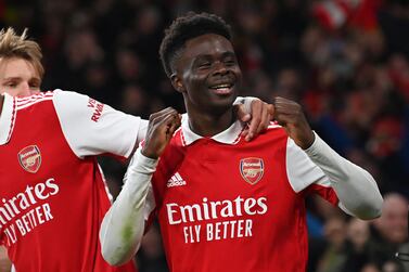 Arsenal's English midfielder Bukayo Saka celebrates aftetr scoring their second goal during the English Premier League football match between Arsenal and Manchester United at the Emirates Stadium in London on January 22, 2023.  (Photo by Glyn KIRK / AFP) / RESTRICTED TO EDITORIAL USE.  No use with unauthorized audio, video, data, fixture lists, club/league logos or 'live' services.  Online in-match use limited to 120 images.  An additional 40 images may be used in extra time.  No video emulation.  Social media in-match use limited to 120 images.  An additional 40 images may be used in extra time.  No use in betting publications, games or single club/league/player publications.   /  