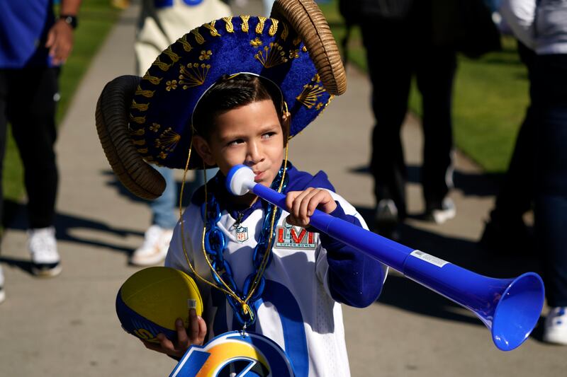A young Rams fan plays hooky to see his Los Angeles Rams at the victory parade. AP