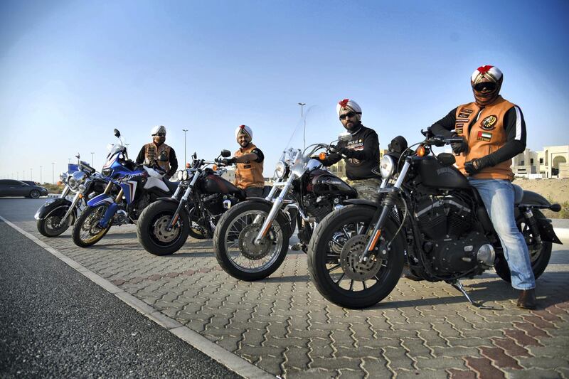 Gurnam Singh, far left, founder of the Sikh Bikers group along with other members prepare for the 48th National Rally "Love Zayed" in Sharjah, UAE, Friday, Nov. 29, 2019. Shruti Jain The National