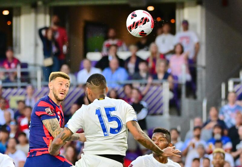 Paul Arriola heads home the United States' second goal.