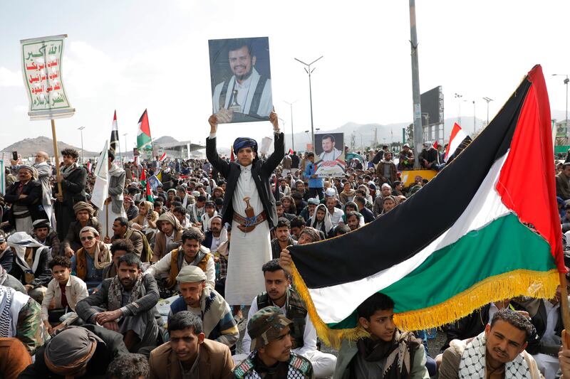 A protestor holds up a photo of top Houthi leader Abdul-Malik al-Houthi in Sana'a, Yemen. The militant group has sought to open another front against Israel amid its war on Gaza and has been attacking vessels in the Red Sea since November. EPA