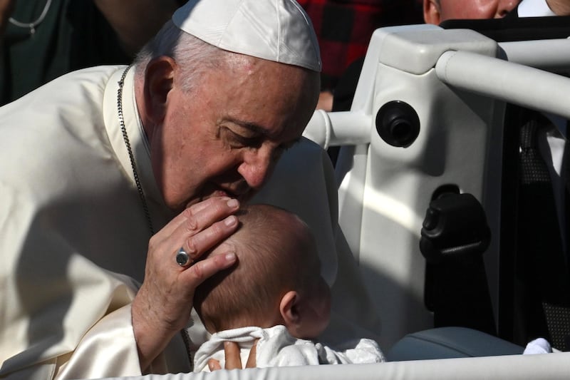 Pope Francis blesses a baby upon his arrival at the National Shrine of Sainte-Anne-de-Beaupre. EPA