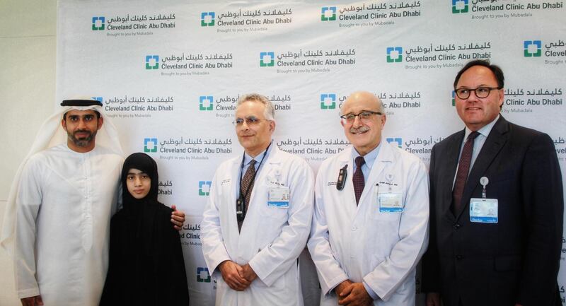Gene therapy patient Alia with her father Mubarak (L) and surgeons at Cleveland Clinic Abu Dhabi. Courtesy of Cleveland Clinic Abu Dhabi