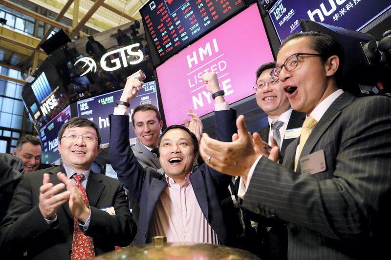 Huami Corporation CEO, Wang Huang  celebrates his company's IPO on the floor of the New York Stock Exchange, (NYSE) in New York, U.S., February 8, 2018. REUTERS/Brendan McDermid