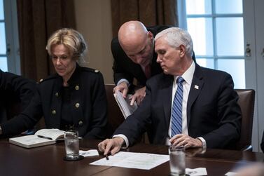 Vice President Mike Pence and his chief of staff Mark Short confer during a meeting with Debbie Birx, the White House coronavirus response co-ordinator. AFP