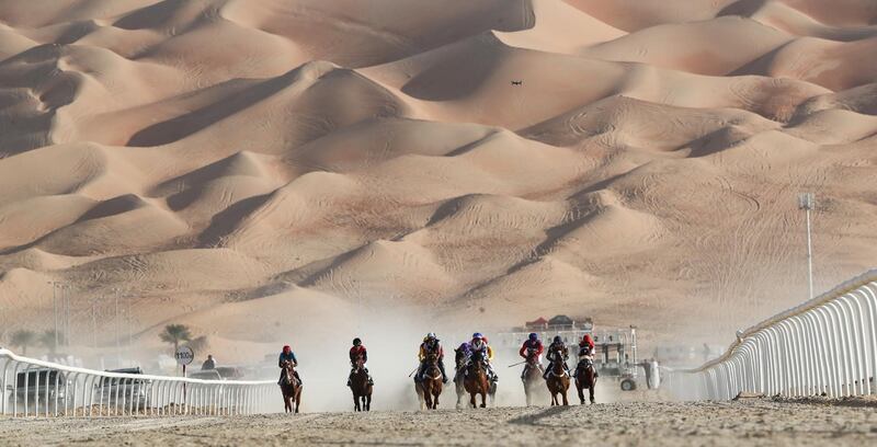 Jockeys compete in a race for purebred Arab horses during the Liwa 2019 Moreeb Dune Festival in the Liwa desert. AFP