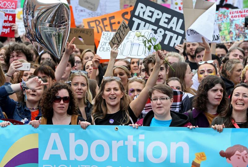 (FILES) In this file photo taken on September 30, 2017 protesters hold up placards as they take part in the March for Choice, calling for the legalising of abortion in Ireland after the referendum announcement, in Dublin.   
Ireland will hold a referendum on its restrictive abortion laws at the end of May, Prime Minister Leo Varadkar announced on January 29, 2018. "This evening, the cabinet gave formal approval to the holding of a referendum on abortion, which will be held at the end of May," Varadkar said at a press conference in Dublin, adding that the exact date would be known following the conclusion of debates in parliament.
 / AFP PHOTO / Paul FAITH