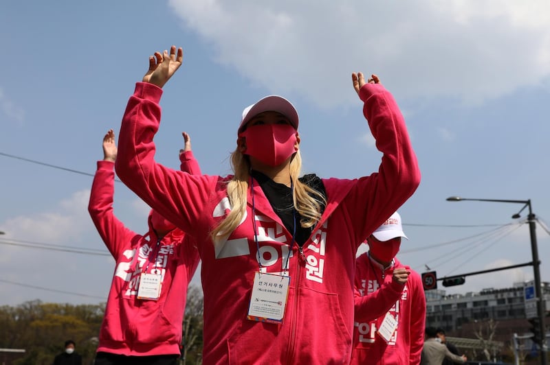 Supporters of parliamentary election candidate Hwang Kyo-ahn of the main opposition United Future Party cheer during his street campaign, April 10, Seoul, South Korea. Chung Sung-Jun/Getty