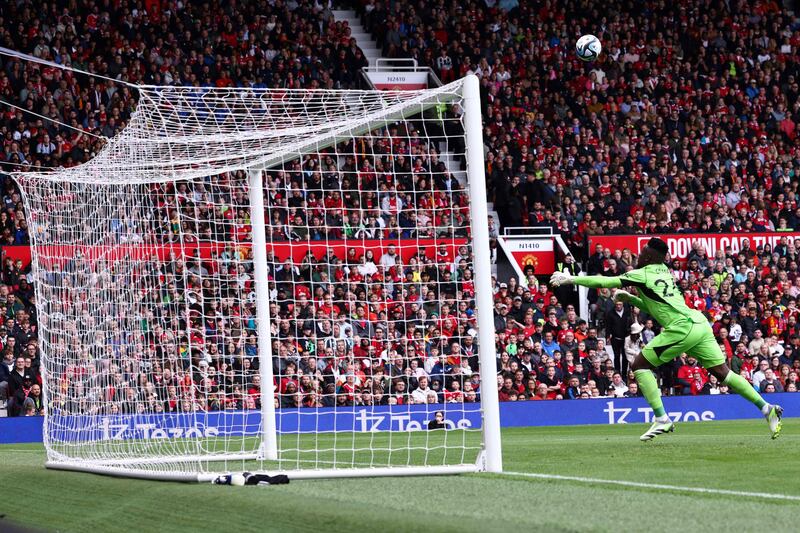 Lens' forward Florian Sotoca scores past Manchester United goalkeeper Andre Onana. AFP