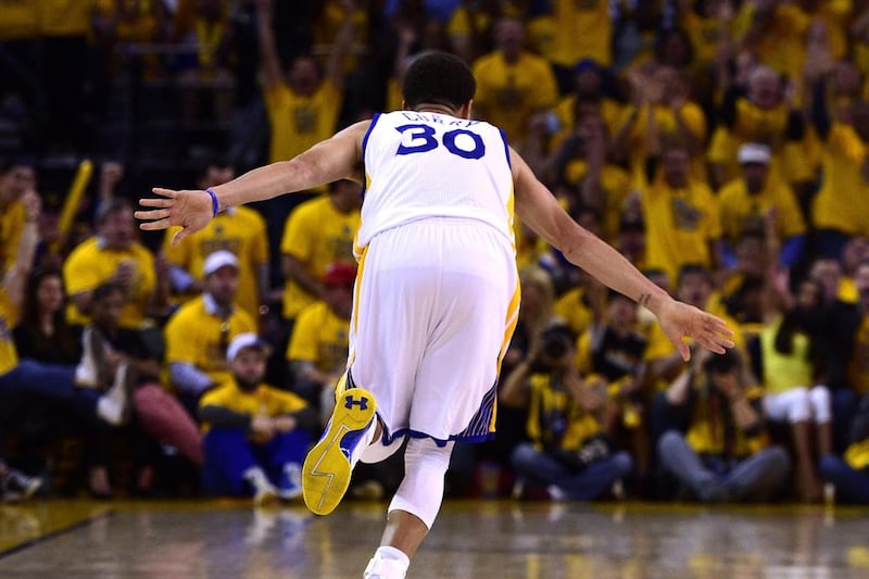 Stephen Curry reacts after making a shot against the Memphis Grizzlies on Sunday during the Golden State Warriors' Game 1 win in the NBA play-offs second round. John G Mabanglo / EPA / May 3, 2015
