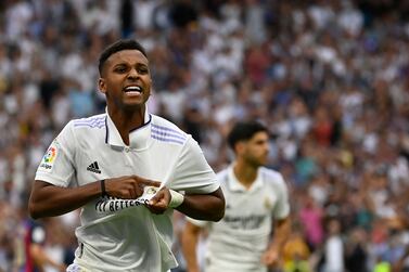 Real Madrid's Brazilian forward Rodrygo celebrates after scoring his team's third goal during the Spanish League football match between Real Madrid CF and FC Barcelona at the Santiago Bernabeu stadium in Madrid on October 16, 2022.  (Photo by PIERRE-PHILIPPE MARCOU  /  AFP)