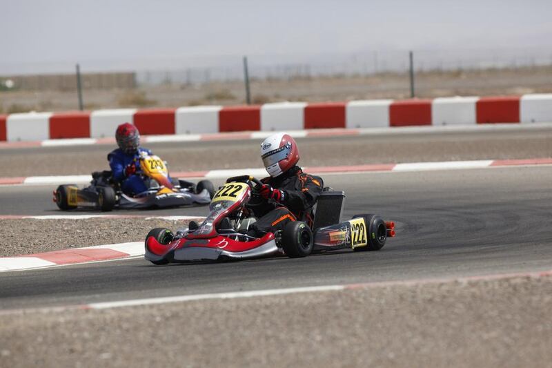 Mohammed Al Dhaheri, center, may be too old to build much upon his success in karting, but a program set out by Abu Dhabi Racing hopes to establish the next generation of Emirati drivers. Antonie Robertson / The National