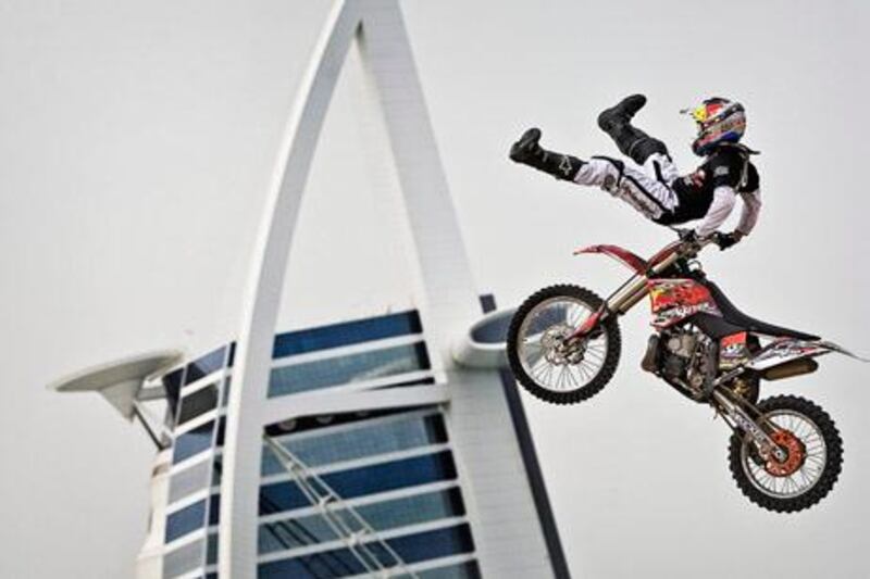 epa02683861 Ronnie Renner of the United States performs during a show jump in front of the Burj al Arab in Dubai, United Arab Emirates, 12 April 2011, to announce the start of the Red Bull X-Fighters World Tour 2011 on April 15.  EPA/JOERG MITTER - GLOBAL NEWSROOM H FOR EDITORIAL USE ONLY. NOT FOR SALE FOR MARKETING OR ADVERTISING CAMPAIGNS EDITORIAL USE ONLY/NO SALES