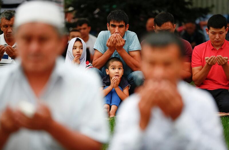 People pray in Almaty, Kazakhstan. Reuters