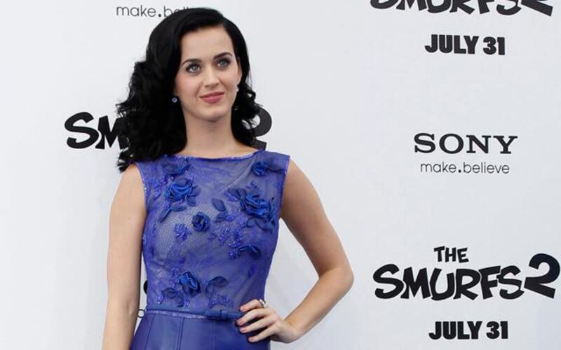 Singer Katy Perry, who voiced the character of "Smurfette", poses at the premiere of "The Smurfs 2" at the Regency Village theatre in Los Angeles, California July 28, 2013. The movie opens in the U.S. on July 31.  REUTERS/Mario Anzuoni  (UNITED STATES - Tags: ENTERTAINMENT)