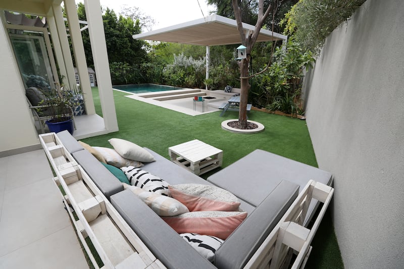 The garden has ample seating area and a private pool