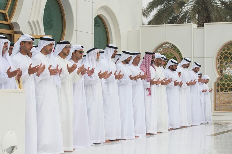 ABU DHABI, UNITED ARAB EMIRATES -September 01, 2017: HH Sheikh Mohamed bin Zayed Al Nahyan, Crown Prince of Abu Dhabi and Deputy Supreme Commander of the UAE Armed Forces (7th L), prays at the grave of his father, the late Sheikh Zayed bin Sultan bin Zayed Al Nahyan, President of the United Arab Emirates, during Eid Al Adha prayers at the Sheikh Zayed Grand Mosque. Seen are (L-R) HH Sheikh Nahyan bin Mubarak Al Nahyan, UAE Minister of Culture and Knowledge Development, HH Sheikh Khaled bin Zayed Al Nahyan, Chairman of the Board of Zayed Higher Organization for Humanitarian Care and Special Needs (ZHO), HH Sheikh Abdullah bin Zayed Al Nahyan, UAE Minister of Foreign Affairs and International Cooperation, HH Sheikh Mansour bin Zayed Al Nahyan, UAE Deputy Prime Minister and Minister of Presidential Affairs, HH Sheikh Hazza bin Zayed Al Nahyan, Vice Chairman of the Abu Dhabi Executive Council, HE Dr Farouq Hammada Islamic Consultant for the Crown Prince Court of Abu Dhabi, HH Sheikh Mohamed bin Zayed Al Nahyan, Crown Prince of Abu Dhabi and Deputy Supreme Commander of the UAE Armed Forces, HH Sheikh Nahyan Bin Zayed Al Nahyan, Chairman of the Board of Trustees of Zayed bin Sultan Al Nahyan Charitable and Humanitarian Foundation, HH Lt General Sheikh Saif bin Zayed Al Nahyan, UAE Deputy Prime Minister and Minister of Interior, HH Sheikh Tahnoon bin Zayed Al Nahyan, UAE National Security Advisor, HH Sheikh Hamed bin Zayed Al Nahyan, Chairman of the Crown Prince Court of Abu Dhabi and Abu Dhabi Executive Council Member, HH Sheikh Omar bin Zayed Al Nahyan, Deputy Chairman of the Board of Trustees of Zayed bin Sultan Al Nahyan Charitable and Humanitarian Foundation, HH Sheikh Abdullah bin Mohamed bin Khaled Al Nahyan Chairman of Al Ain Club Football Company, HH Sheikh Zayed bin Mohamed bin Hamad bin Tahnoon Al Nahyan, and HH Major General Sheikh Khaled bin Mohamed bin Zayed Al Nahyan, Deputy National Security Adviser. 
( Ryan Carter / Crown Prince Court - Abu Dhabi )
---