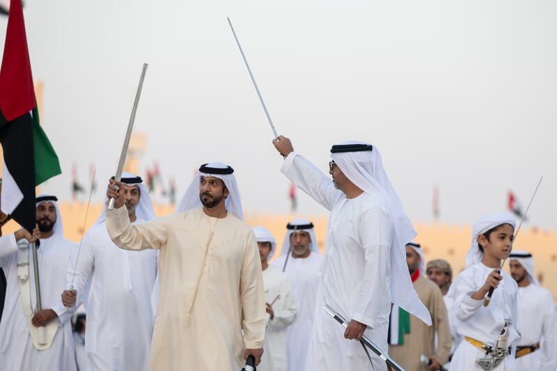 Sheikh Saif, Sheikh Khalifa bin Mohamed Al Nahyan, UAE ambassador to Jordan, and other Sheikhs take part in a traditional dance. Abdulla Al Neyadi / Presidential Court