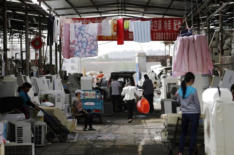 Laundry is hung out to dry in the yard of a recycling workers’ tenement house in Dongxiaokou village. Kim Kyung-Hoon / Reuters