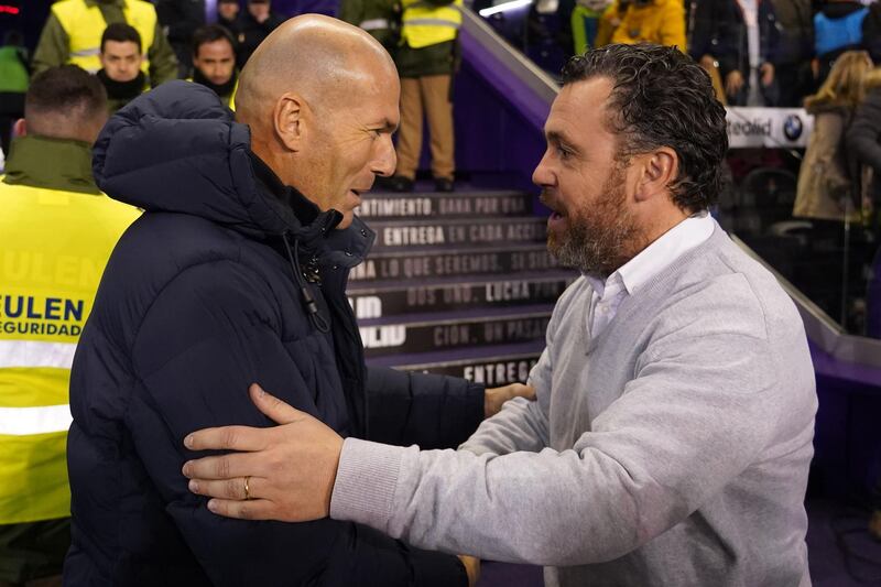 Real Valladolid's Spanish coach Sergio Garcia shakes hand with Real Madrid's French coach Zinedine Zidane before the match. AFP