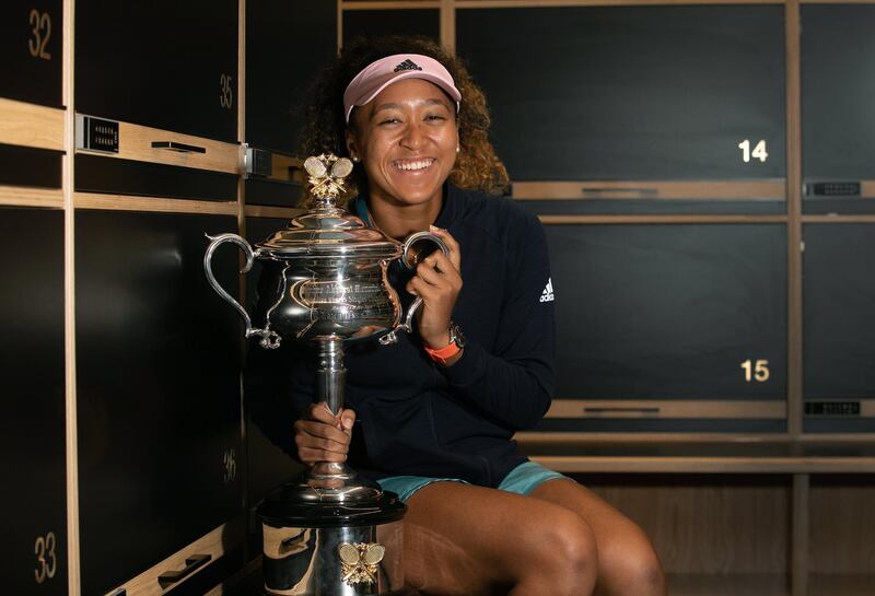 epa07323486 Naomi Osaka of Japan poses for photos in the locker room after winning her women's singles final match against Petra Kvitova of the Czech Republic at the Australian Open Grand Slam tennis tournament in Melbourne, Victoria, Australia, 27 January 2019.  EPA/TENNIS AUSTRALIA/FIONA HAMILTON HANDOUT  AUSTRALIA AND NEW ZEALAND OUT HANDOUT EDITORIAL USE ONLY