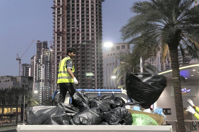 DUBAI, UNITED ARAB EMIRATES - Jan 1, 2018. 

On their seventh clean up rotation for the night, sweepers clean the streets at Downtown Dubai after New Year's Eve.

(Photo by Reem Mohammed/The National)

Reporter: Nawal Al Rawahi

Section: NA