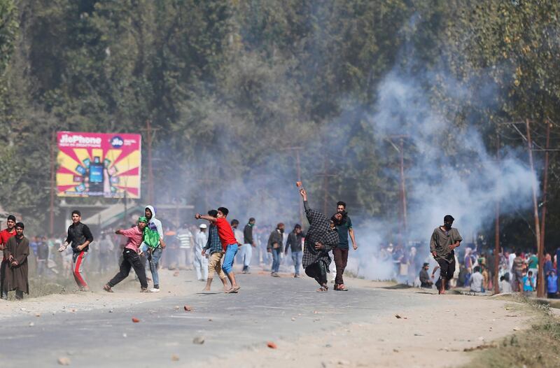 Kashmiri villagers clash with government forces in Hajin, 38 kilometers (24 miles) north of Srinagar, Indian controlled Kashmir, Wednesday, Oct. 11, 2017. Soldiers began an anti-militant operation by cordoning off northern Hajin town on a tip that rebels were hiding in the area. Two Indian air force commandos and two rebels were killed in the ensuing intense fighting. Street clashes erupted shortly after the fighting ended as hundreds of residents demanded an end to Indian rule in Kashmir. (AP Photo/Mukhtar Khan)