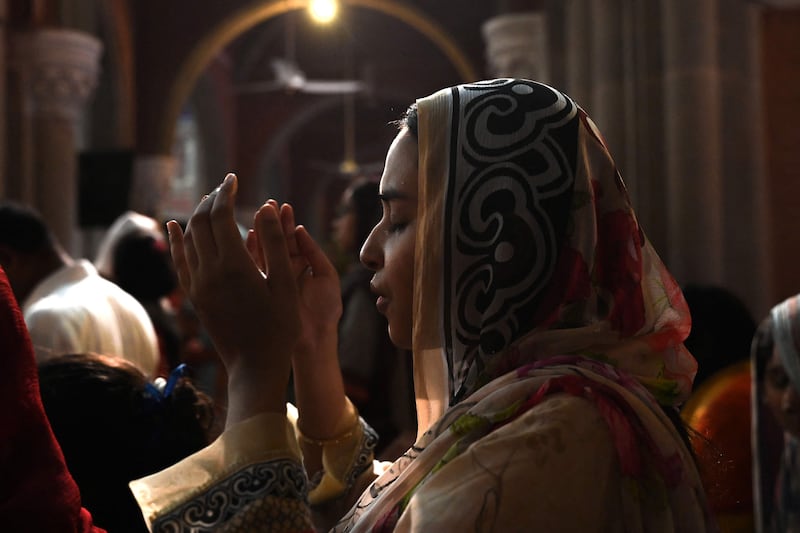 A Christian woman attends the Sunday Service at the Sacred Heart Cathedral in Lahore after mobs attacked several Pakistani churches over blasphemy allegations. AFP