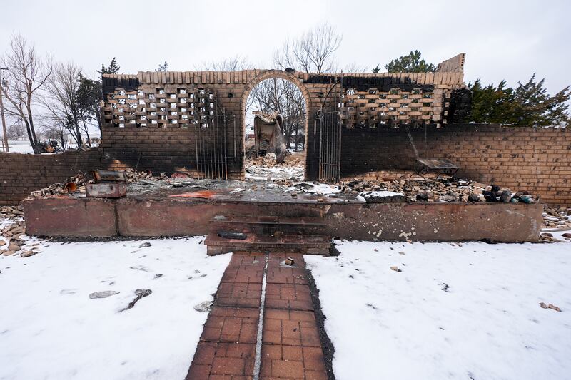 The charred remains of a property destroyed by the Smokehouse Creek fire. AP