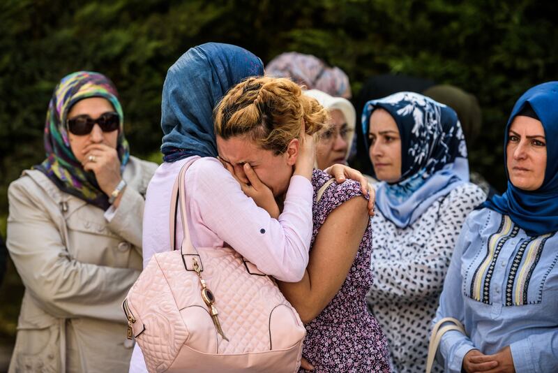 Relatives of a victim of the Ataturk airport attack in June 2016 mourn in Istanbul during his funeral. AFP