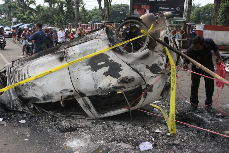 A damaged car is pictured following a riot after the league BRI Liga 1 football match between Arema vs Persebaya at Kanjuruhan Stadium, Malang, East Java. Reuters