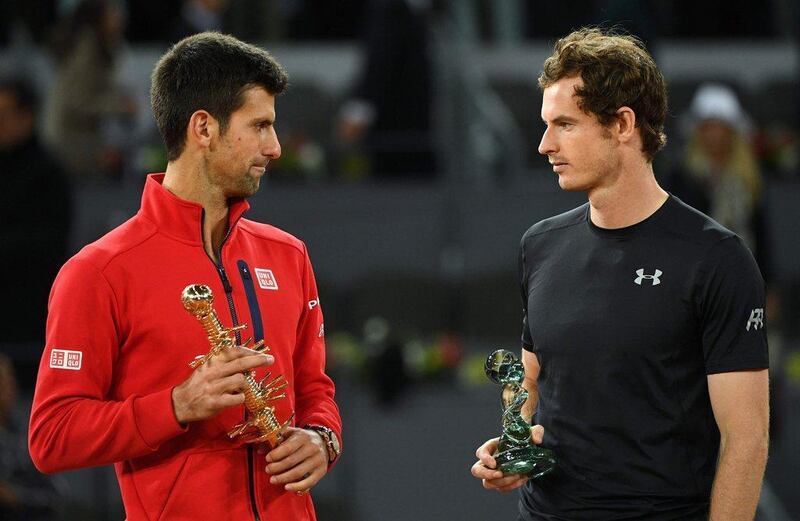 Novak Djokovic, left, and Andy Murray pose with their trophies after the Madrid Open final. Gerard Julien / AFP 

