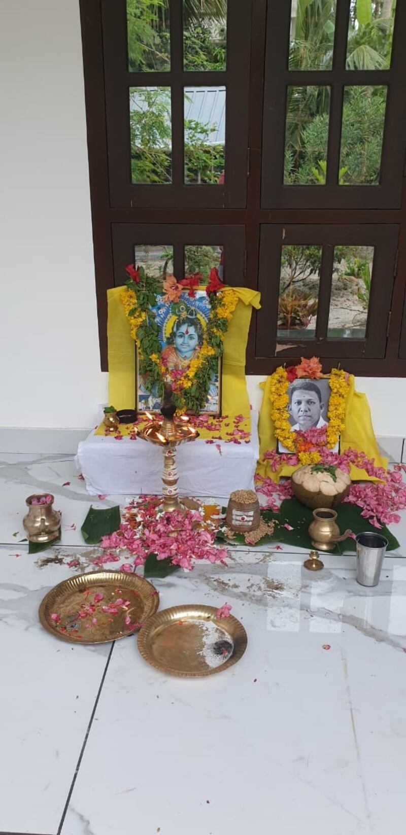 Prayers and flowers are offered by the family of Deepa Kumar in Kerala, southern India three years to the day he died in a car accident on Monday. Photo: Kumar family