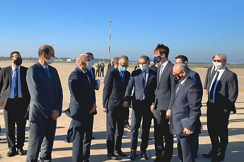 A screen grab from a handout video released by the US embassy in Morocco shows US President's advisor Jared Kushner (3rd R) and Israeli National Security Advisor Meir Ben Shabbat (2nd R) arriving in Moroco's capital Rabat, on the first Israel-Morocco direct commercial flight, marking the latest US-brokered diplomatic normalisation deal between the Jewish state and an Arab country.  AFP