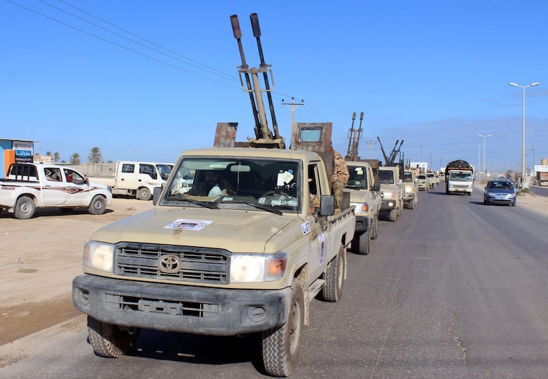 Military vehicles of the Libyan internationally recognised government forces head out to the front line from Misrata, Libya. REUTERS