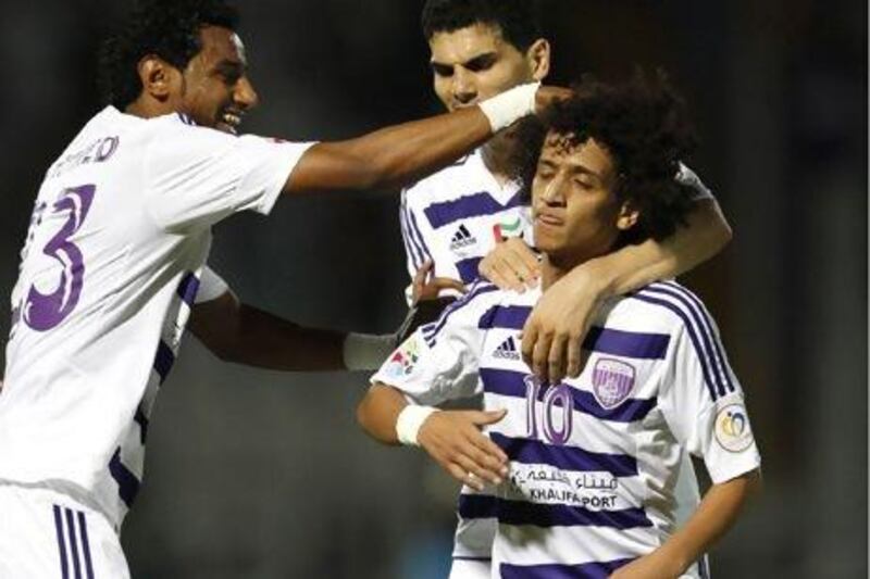 Al Ain officials announced they will begin transfer talks for their star player Omar Abdulrahman, centre, with interested European clubs next month. AFP