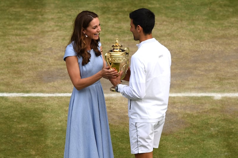 Catherine presents Novak Djokovic with the Wimbledon men's singles trophy in July 2019