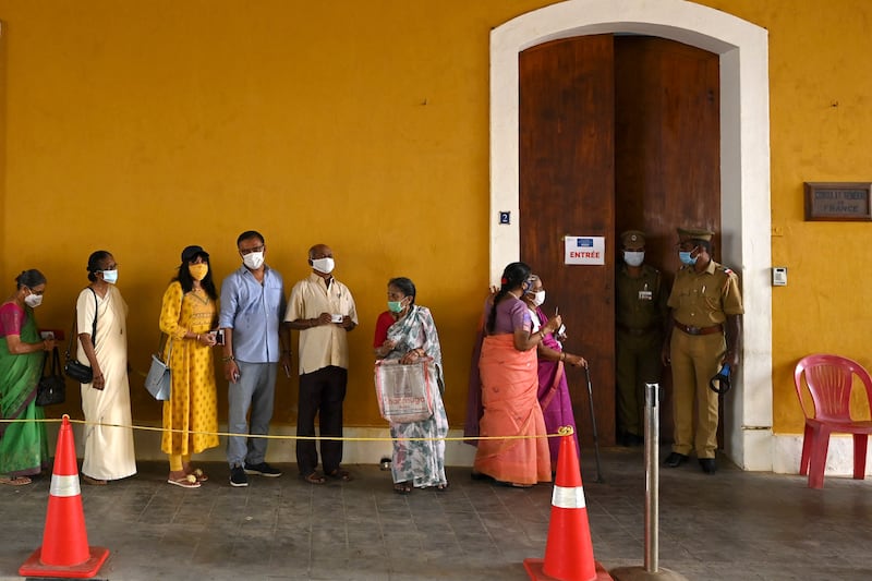 French citizens living in India arrive to cast their votes at France's consulate general, in the region of Pondicherry. AFP