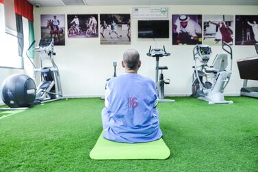 An inmate begins a yoga session at Dubai Central Correctional Facility. Reem Mohammed / The National
