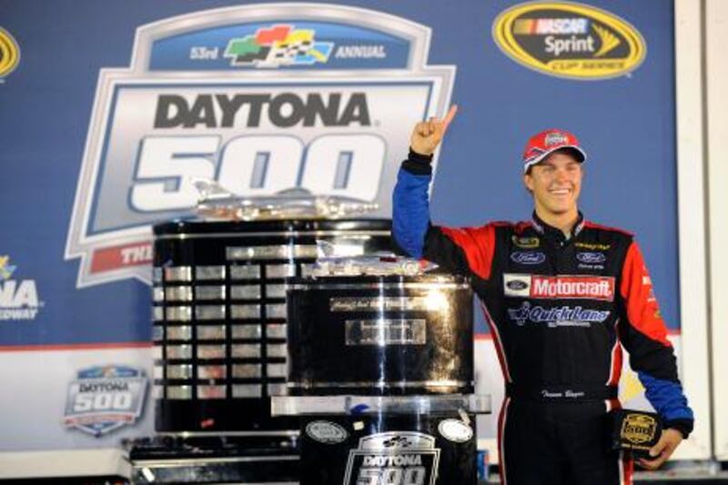 Sprint Cup Series driver Trevor Bayne stands next to the trophy in victory lane after winning the NASCAR Sprint Cup Series Daytona 500 race at the Daytona International Speedway in Daytona Beach, Florida February 20, 2011. Rookie Bayne became the youngest driver to win the Daytona 500 on Sunday by capturing NASCAR's season opener a day after his 20th birthday in an incident-packed race. REUTERS/Brian Blanco (UNITED STATES - Tags: SPORT MOTOR RACING) *** Local Caption ***  DAY510_MOTORRACING-_0221_11.JPG