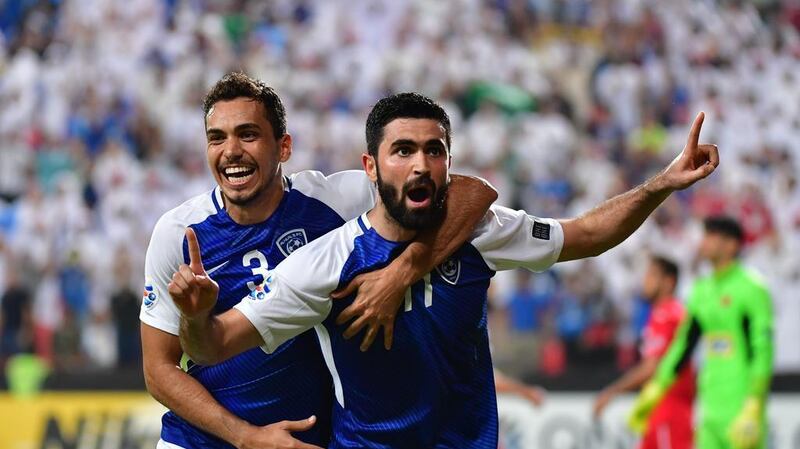 Al Hilal's Syrian forward Omar Khribin, right, scored a hat-trick against Iran's Persepolis in the first leg of the Asian Champions League semi-final played at Mohammed bin Zayed Stadium in Abu Dhabi. Giuseppe Cacace / AFP
