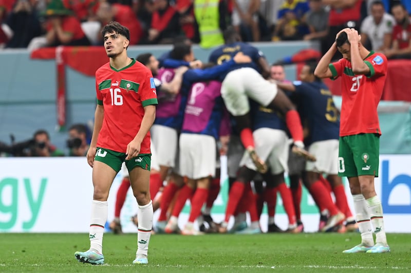 Morocco's Abde Ezzalzouli looks downcast after France celebrate their second goal in the 2-0 World Cup semi-final win at Al Bayt Stadium in Al Khor, Qatar, on December 14, 2022. EPA