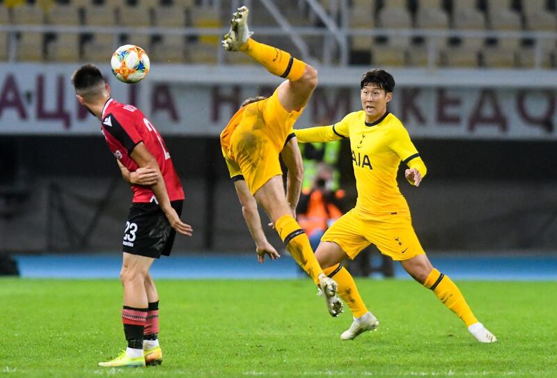 Son Heung-Min, right, and Ben Davies of Tottenham Hotspur fight for the ball with Valjmir Nafliu of Shkendija. AFP