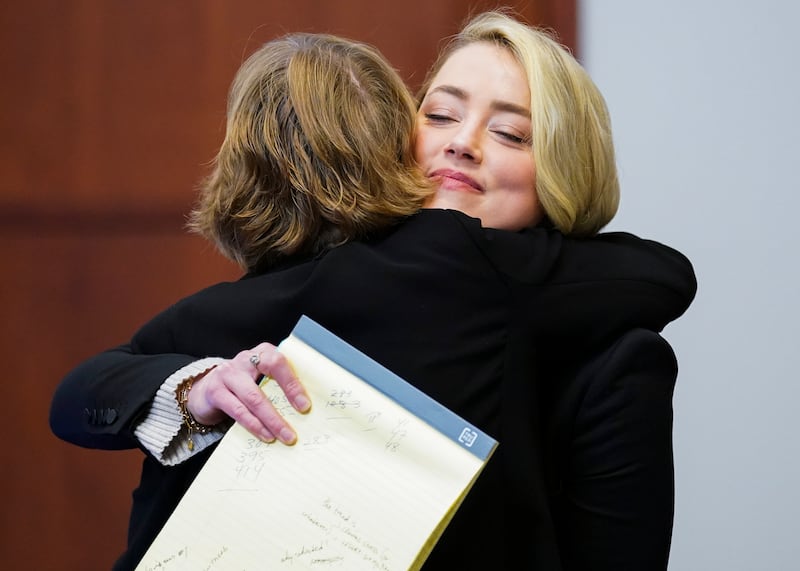 Heard embraces her lawyer Elaine Bredehoft. AP