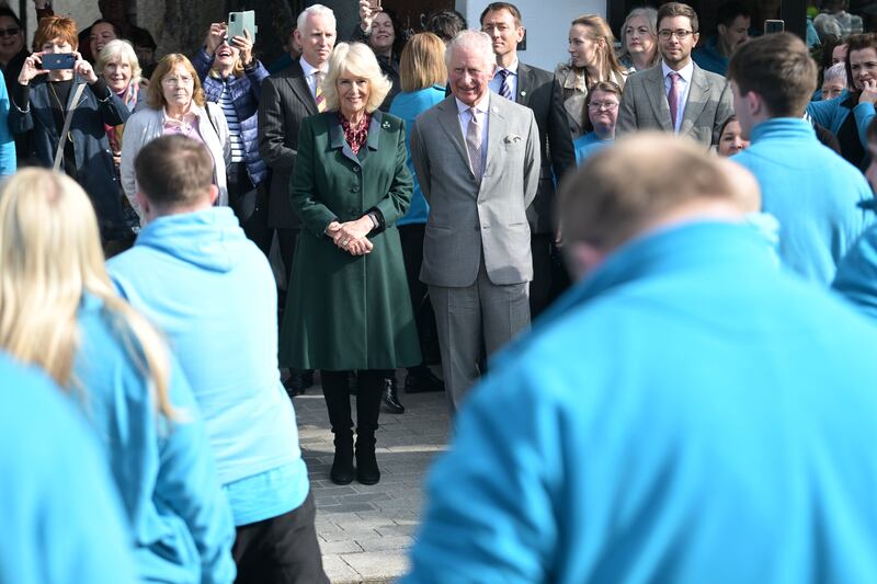 The Prince of Wales and his wife Camilla were greeted by schoolchildren on Tuesday on their royal visit to Northern Ireland. Getty Images