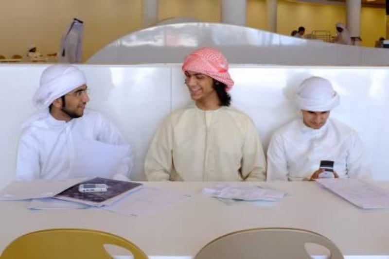 September 11. Left to right: Mohamed Al Blooki (19), Khaled Ahmed (18) and Ahmed Al Yamani (19) take a break in the cafeteria of the newly opened Zayed University Campus.
"Now we feel like we are at a real university, before it was in a school building. Here we have everything." Says Mohamed Al Booki. September 11, Abu Dhabi. United Arab Emirates (Photo: Antonie Robertson/The National)