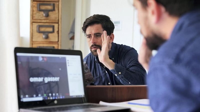 Zack Stewart, grade 12 teacher at the Dubai American Academy, holds an online class from his home in Dubai. Pawan Singh / The National