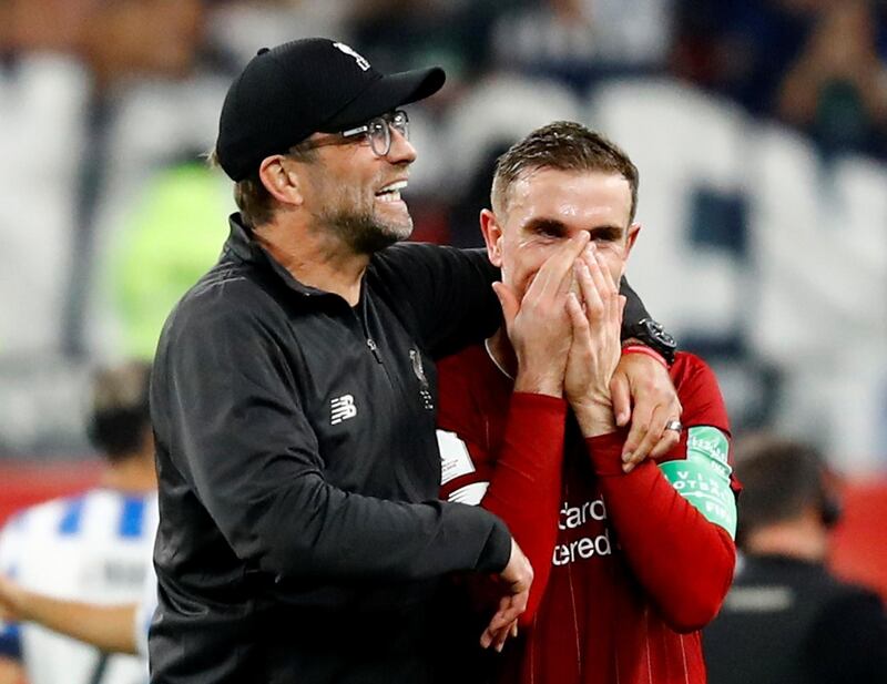 Liverpool manager Juergen Klopp celebrates with Jordan Henderson after the match. Reuters