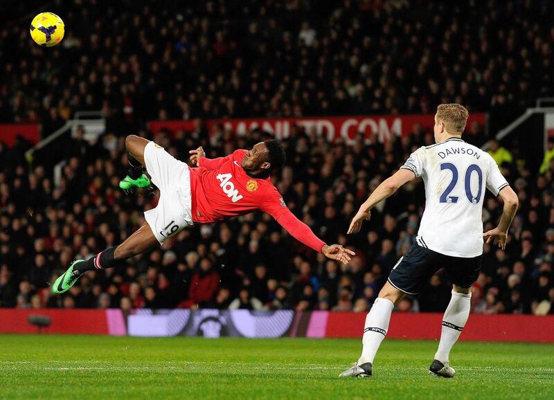 Manchester United striker Danny Welbeck, left, attempts an overhead kick during an English Premier League football match against Tottenham Hotspur on Wednesday. Andrew Yates / AFP