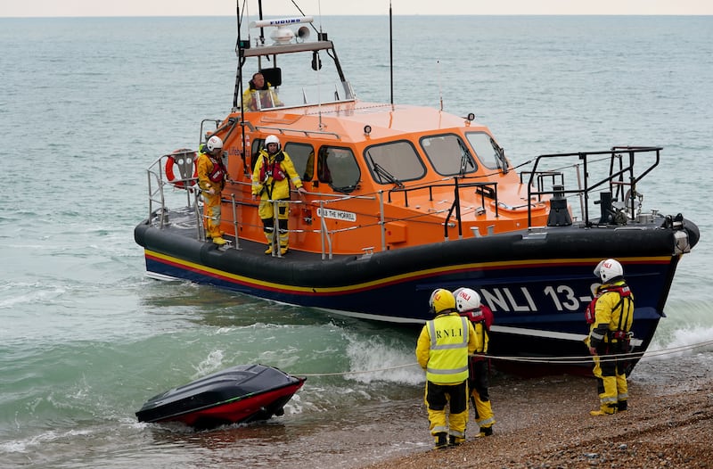 An RNLI boat brings the jet ski to shore at Dungeness. PA